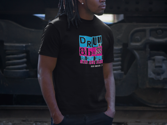 Young African-American man wearing a black organic cotton t-shirt, with a cyan and magneta blocky design in the middle of the chest saying 'Drum & Bass in yer face all day long'. He looks cool in his Sub Threads T-shirt pondering how the sustainable and eco-friendly production and fulfilment of Sub Threads products can help him look this cool while he's doing his bit to help the planet. He's impressed.